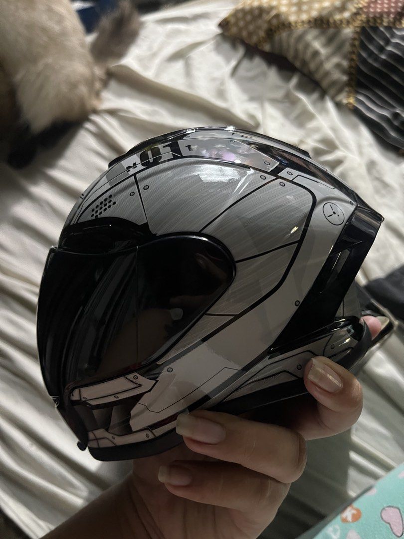 Motorcycle CAT Helmet - Black and Silver (Category: Homes & Other Pet Accessories) located in Manila. Submitted by goose_bear (Listing ID 1438301510, Image 3). Description: Stylish CAT motorcycle helmet with a sleek black and silver design. Features a dark visor for sun protection. The helmet has a unique geometric pattern on the top and sides. loc. Antipolo/Pasay.
