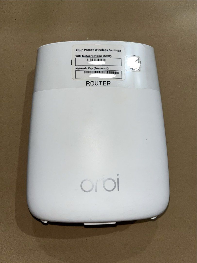 Netgear Orbi Router RBR20 (Category: Networking) located in Malabon City. Submitted by erichiee (Listing ID 1438251591, Image 1). Description: - Netgear Orbi RBR20 Router - Includes router unit and power adapter - Ports: Internet, Ethernet, Power, Reset - Features the Orbi logo - Power adapter brand: Linksys -no box.
