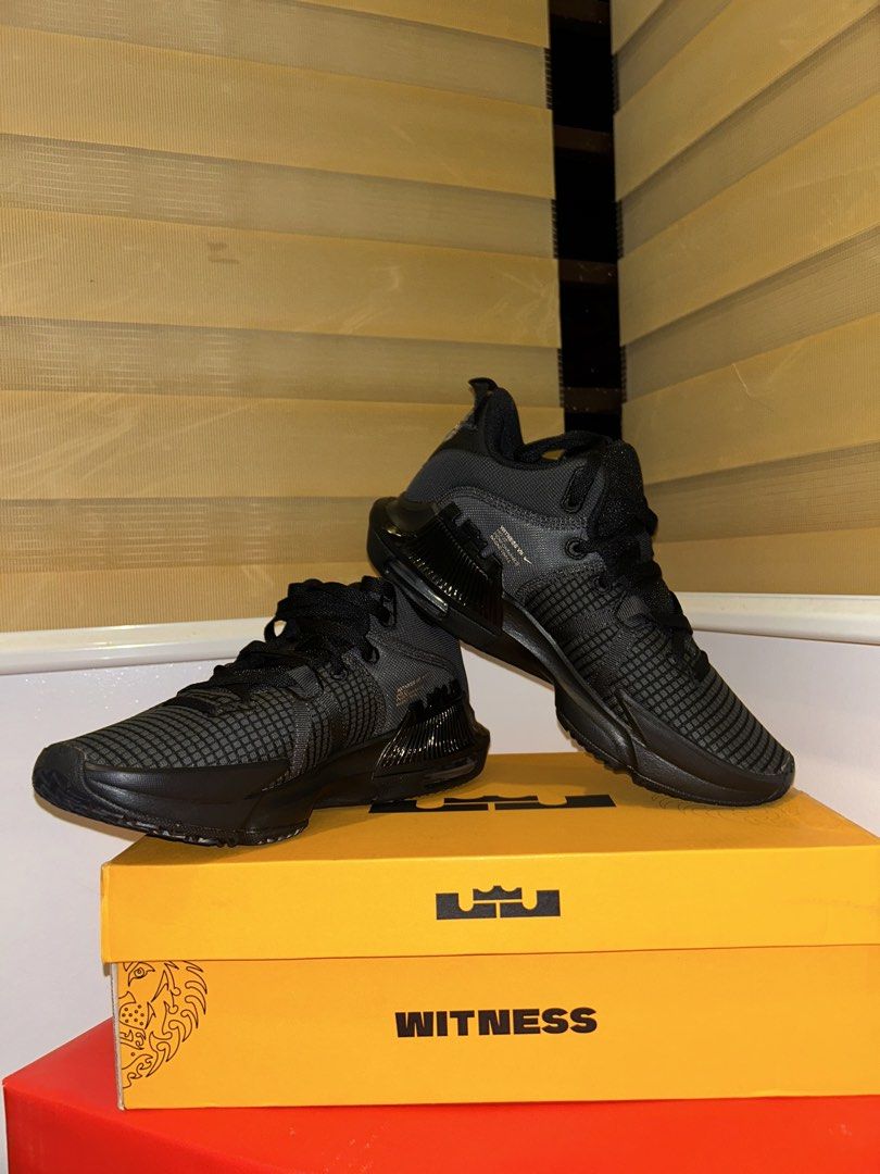 Nike LeBron Witness VII Black (Category: Sneakers) located in Baliuag. Submitted by rdoesgetridofstuff (Listing ID 1438234021, Image 1). Description: - Nike LeBron Witness VII - Black colorway - Size: US 9.5, UK 8.5, EUR 43, CM 27.5 - Features textured upper - Nike swoosh visible - Comes with original box (lion graphic).