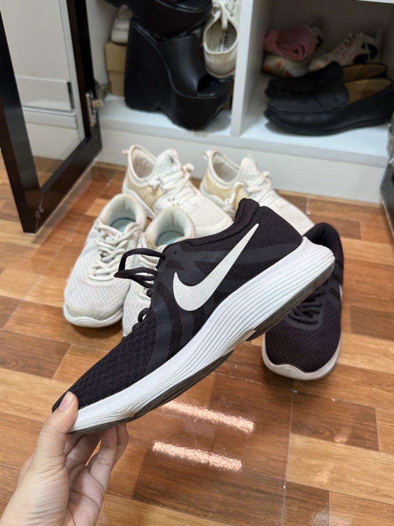 Nike Revolution 4 Black Sneakers (Category: Sneakers) located in Marikina City. Submitted by ms.ces (Listing ID 1438175370, Image 1). Description: - Nike Revolution 4 sneakers - White Nike swoosh - White sole - Size tag visible in photos.