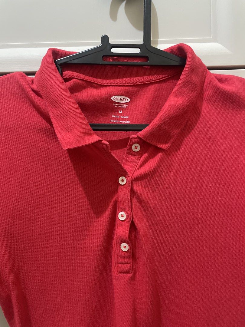 Old Navy Red Polo Shirt - Size M (Category: Shirts) located in Makati City. Submitted by thingsoncelovedph (Listing ID 1438247981, Image 3). Description: - Old Navy red polo shirt - Size: M - Features a classic polo collar - Button-down front - Made of fitted, stretchable material - Solid red color - Made in Vietnam.
