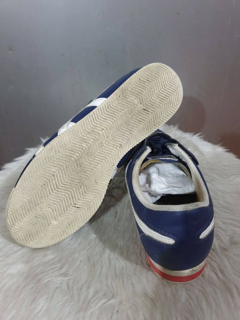 Onitsuka Tiger Kids Shoes (Category: Babies & Kids Fashion) located in Las Pinas. Submitted by anggesmart (Listing ID 1438193224, Image 3). Description: - Navy blue Onitsuka Tiger kids shoes - White stripes - Velcro strap closure with laces - White sole with red accent - Size: 3 US / 35 Euro / 22.0 cm -As is basis, shoes only no box Accepts bpi or gcash.