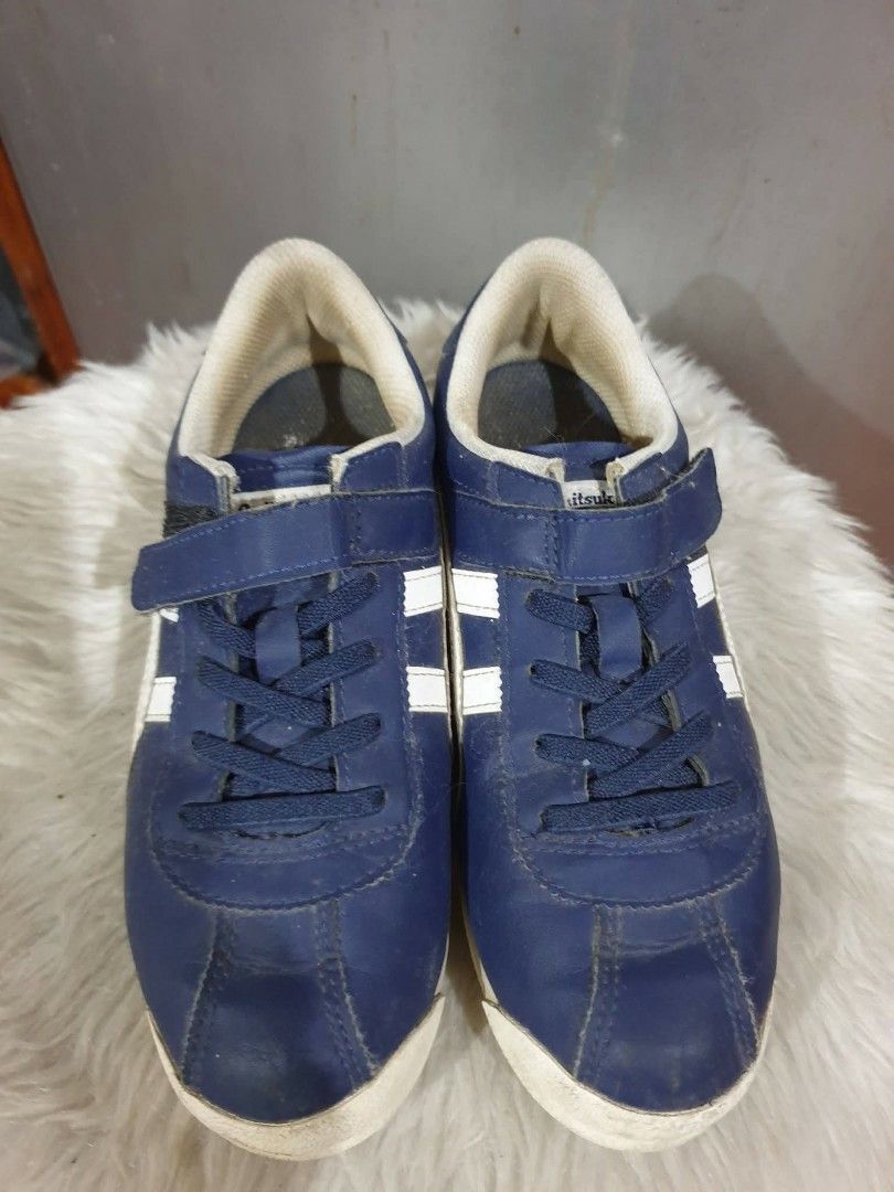 Onitsuka Tiger Kids Shoes (Category: Babies & Kids Fashion) located in Las Pinas. Submitted by anggesmart (Listing ID 1438193224, Image 1). Description: - Navy blue Onitsuka Tiger kids shoes - White stripes - Velcro strap closure with laces - White sole with red accent - Size: 3 US / 35 Euro / 22.0 cm -As is basis, shoes only no box Accepts bpi or gcash.