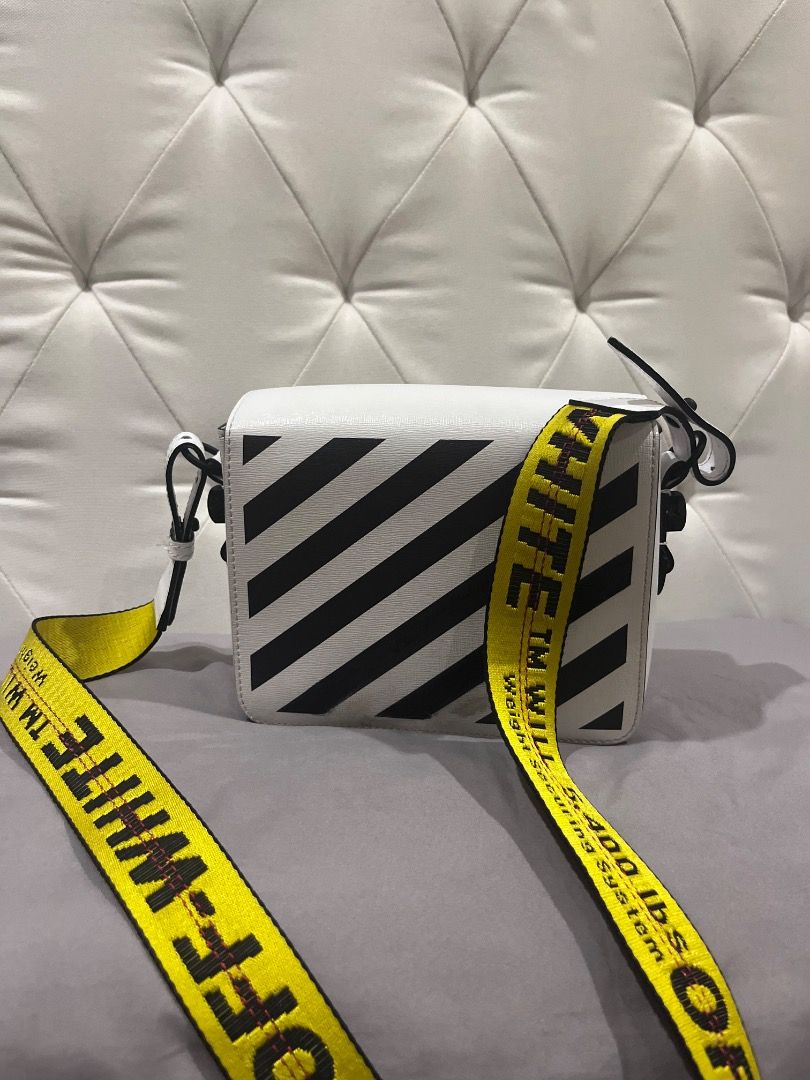 Orig Off-White diagonal Binder clip Bag (Category: Luxury Bags & Wallets) located in Quezon City. Submitted by docagillemontemayor (Listing ID 1438224056, Image 1). Description: Condition 8/10 Complete 3 Slings included and tags Issue: Lost Binder Clip Front bag and minimal stain as seen on picture MONEY BACK IF PROVEN FAKE!💯 Can do meet ups so u can check the bag itself, just message me. DISCLAIMER: We are not associated or affiliated with any 