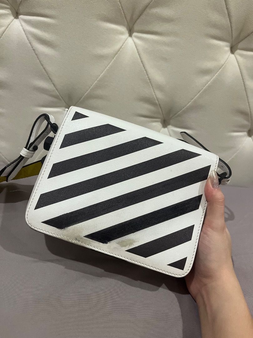 Orig Off-White diagonal Binder clip Bag (Category: Luxury Bags & Wallets) located in Quezon City. Submitted by docagillemontemayor (Listing ID 1438224056, Image 2). Description: Condition 8/10 Complete 3 Slings included and tags Issue: Lost Binder Clip Front bag and minimal stain as seen on picture MONEY BACK IF PROVEN FAKE!💯 Can do meet ups so u can check the bag itself, just message me. DISCLAIMER: We are not associated or affiliated with any 