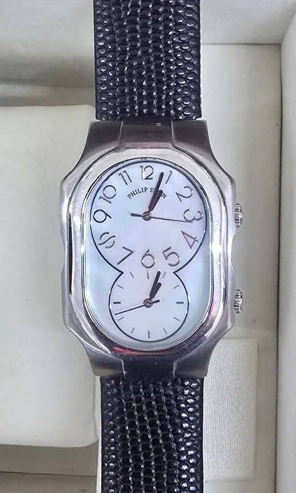 Philip Stein Signature Dual Time Zone (Category: Luxury Watches) located in Lapu Lapu. Submitted by povv-ph (Listing ID 1438117779, Image 2). Description: With Box and Receipt. +Signature "Eight-Shape" Case: Featuring a unique, curved stainless steel silhouette that contours elegantly to the wrist. +Dual Time Zone Dials: The watch face is uniquely divided into two independent subdials, allowing you to monitor two separate time zones simultaneousl