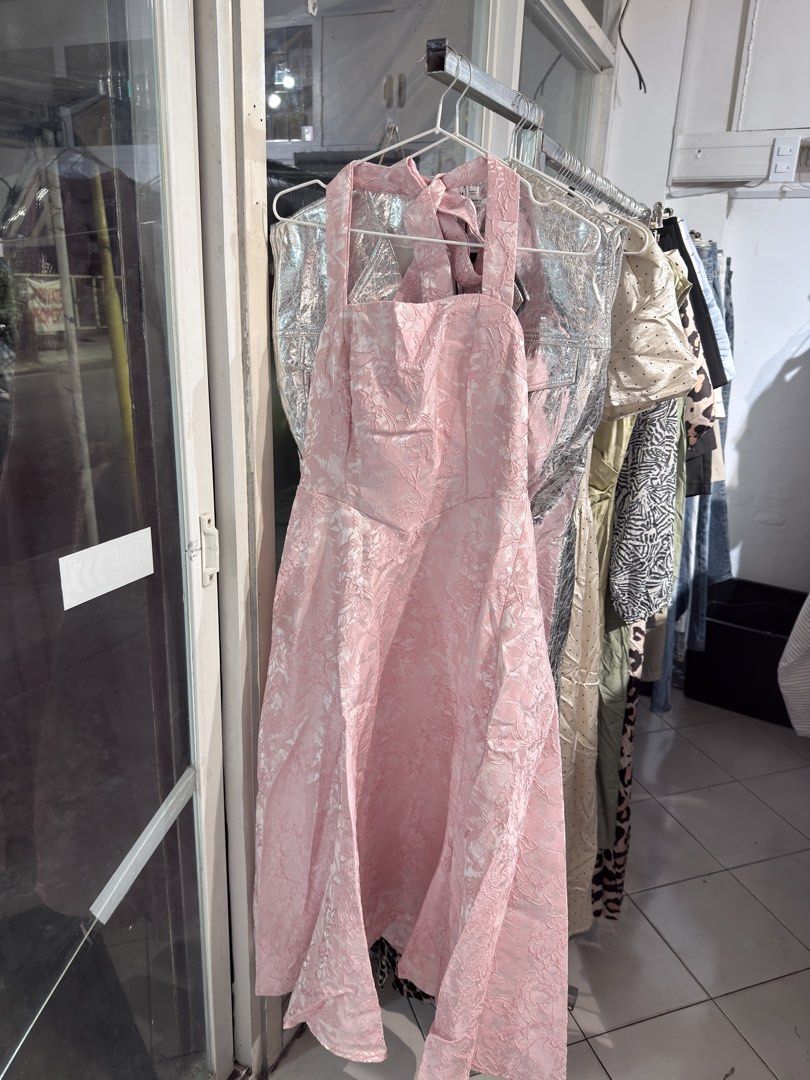 Pink Halter Neck Midi Dress (Category: Dresses) located in Balanga. Submitted by your.hidden.gallery (Listing ID 1438122930, Image 2). Description: - Pink midi dress - Halter neck design - Textured floral pattern - A-line silhouette - Sleeveless - Tie detail at back - Midi length.