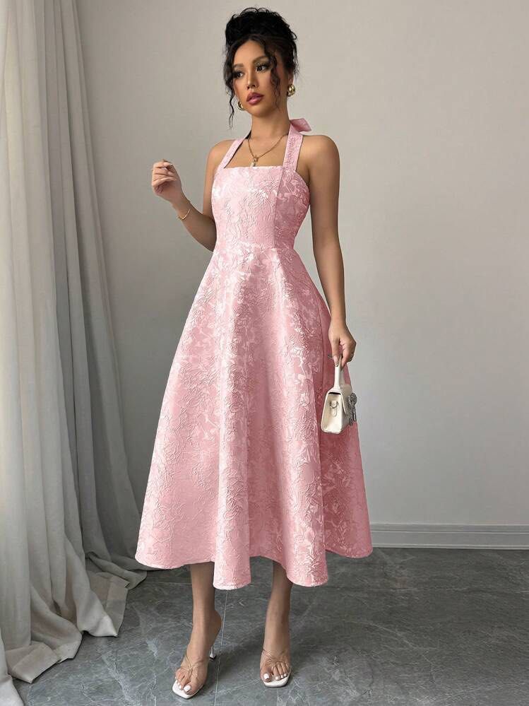 Pink Halter Neck Midi Dress (Category: Dresses) located in Balanga. Submitted by your.hidden.gallery (Listing ID 1438122930, Image 1). Description: - Pink midi dress - Halter neck design - Textured floral pattern - A-line silhouette - Sleeveless - Tie detail at back - Midi length.