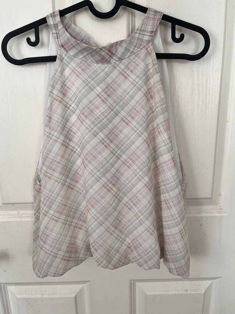 Plaid Halter Top (Category: Sleeveless) located in Bacoor. Submitted by clothestodeclutter (Listing ID 1438143815, Image 1). Description: - Pink, gray, and white plaid halter top - Unique tie-back design - Features a layered, ruffled hem - Lightweight and flowy fabric - Ideal for warm weather.