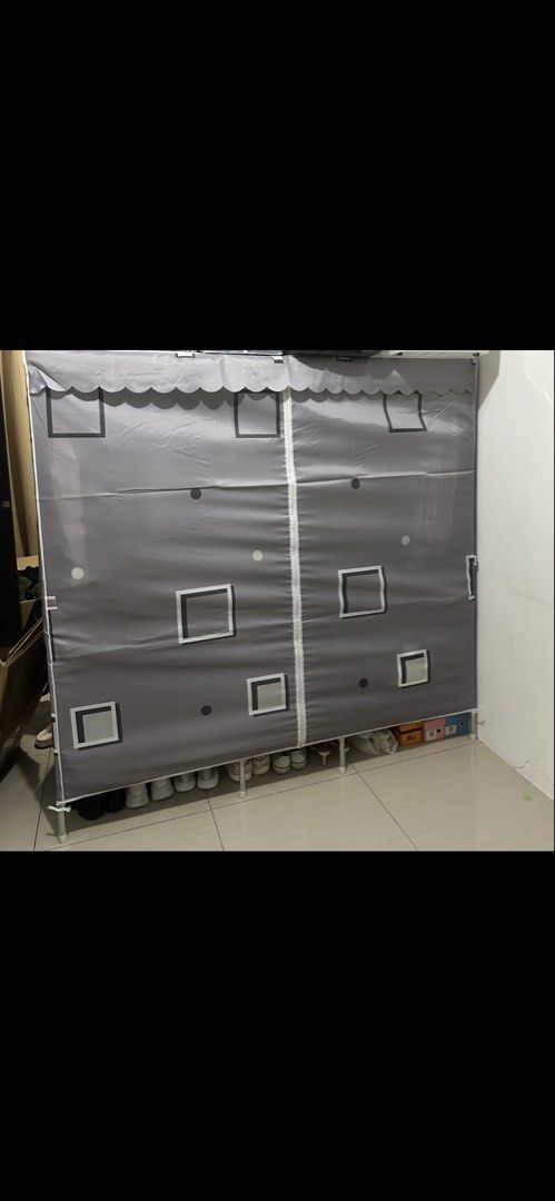 Portable Fabric Wardrobe (Category: Shelves, Cabinets & Racks) located in Antipolo. Submitted by infatuation.ph (Listing ID 1438272969, Image 1). Description: - Portable wardrobe - Gray fabric cover with zipper - White frame - Bottom shelf for storage - Decorated with square and dot patterns - Perfect for clothes and shoes - Great for bedroom or living spaces.