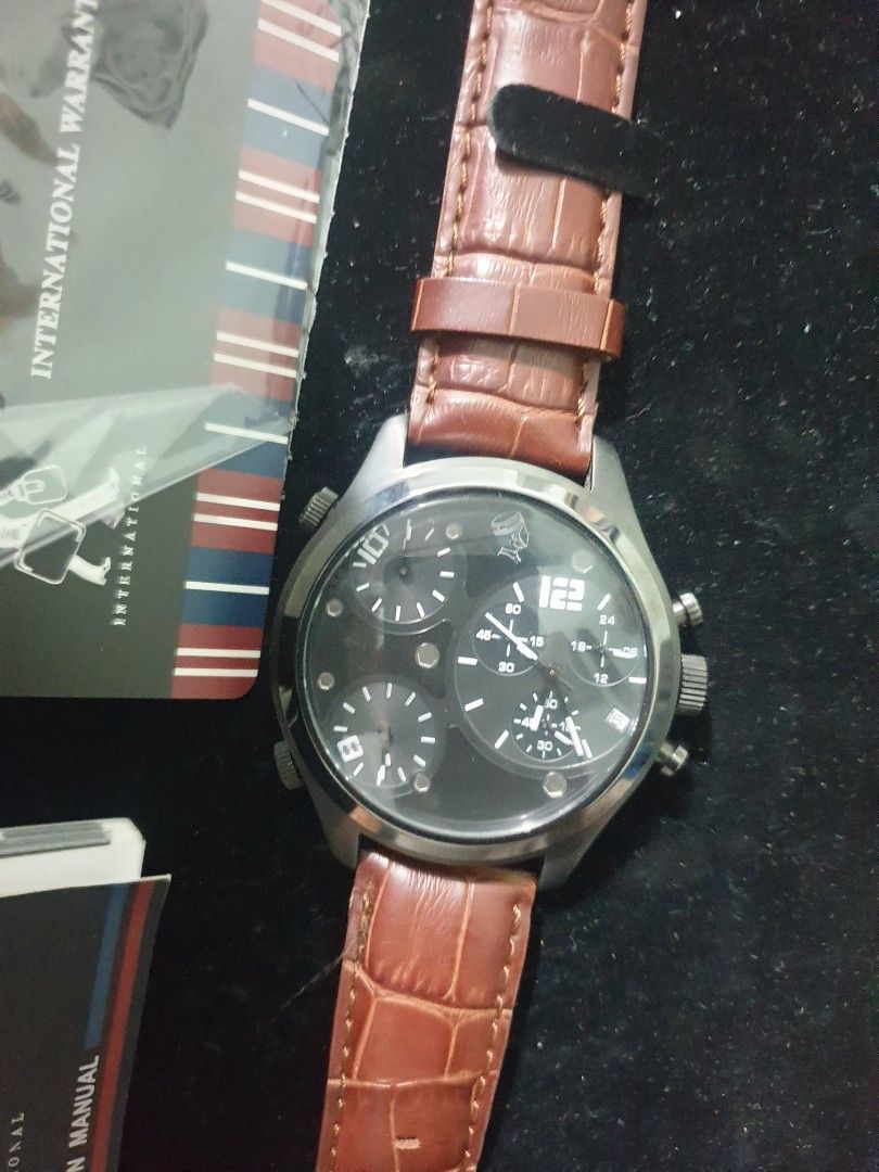 Porter International Chronograph Watch (Category: Men's Watches) located in Dasmarinas. Submitted by mysticfalcon.b6bfec (Listing ID 1438124410, Image 2). Description: - Porter International watch - Brown leather strap - Black dial with chronograph subdials - Includes original box, instruction manual, and warranty card - Stainless steel back with Porter International logo - Water-resistant original price: 20k in peso.