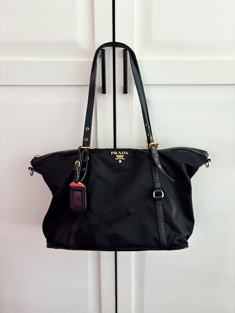 Prada Tessuto Nylon Zipped Tote (Category: Luxury Bags & Wallets) located in Muntinlupa City. Submitted by closet.confessions (Listing ID 1438158638, Image 1). Description: the crowd’s favorite 🖤 PRADA Tessuto Nylon Zipped Tote Rank A comes with hangtag, detachable long strap & provided dustbag 💰 30k ONLY!!! ♣️ *vs other seller’s: 38k up!!!.