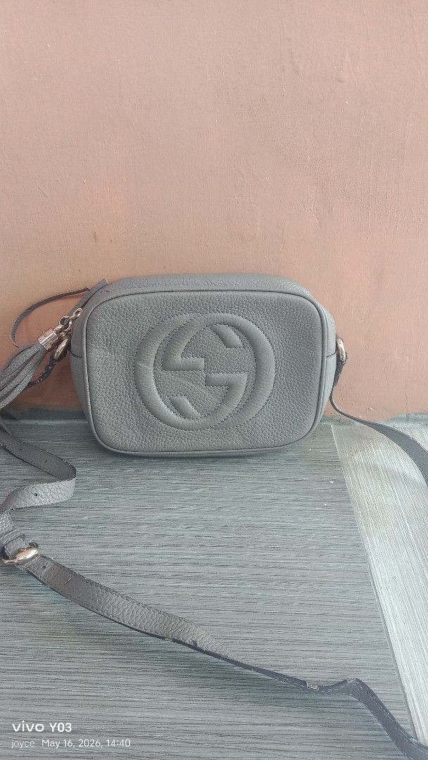 Preloved Gucci Soho Disco Bag (Category: Luxury Bags & Wallets) located in Cabuyao City. Submitted by selections888 (Listing ID 1438172628, Image 1). Description: - preloved Gucci Soho Disco Bag - Color: Gray - Features the iconic interlocking GG logo - Round shape - Long shoulder strap - Tassel zipper pull - Zipper closure - Material: Leather -with signs of use see detailed pics..need bag spa -for sale as is.