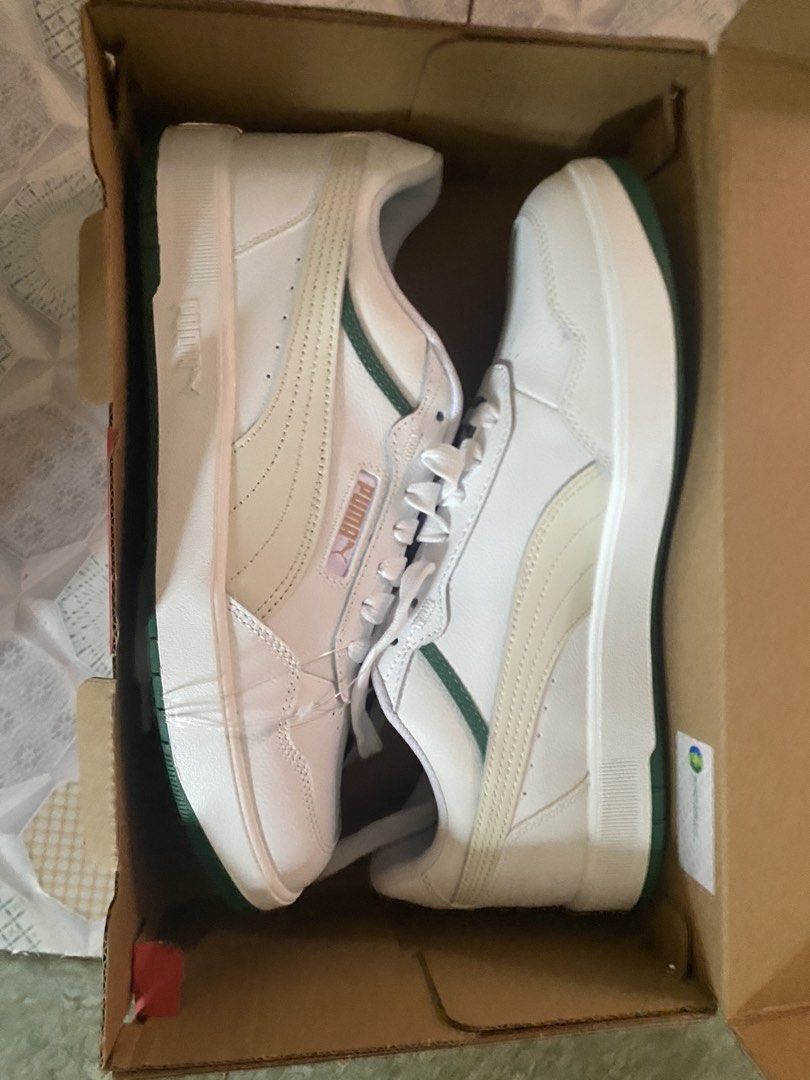 Puma Caven White Green Sneakers (Category: Sneakers) located in Manila. Submitted by kuyamarkthrift (Listing ID 1438218587, Image 1). Description: - Puma Caven sneakers - White upper with green accents - Green sole with Puma logo - Size: US 9, UK 8.5, EUR 42, 27 CM - Brand new in original box.