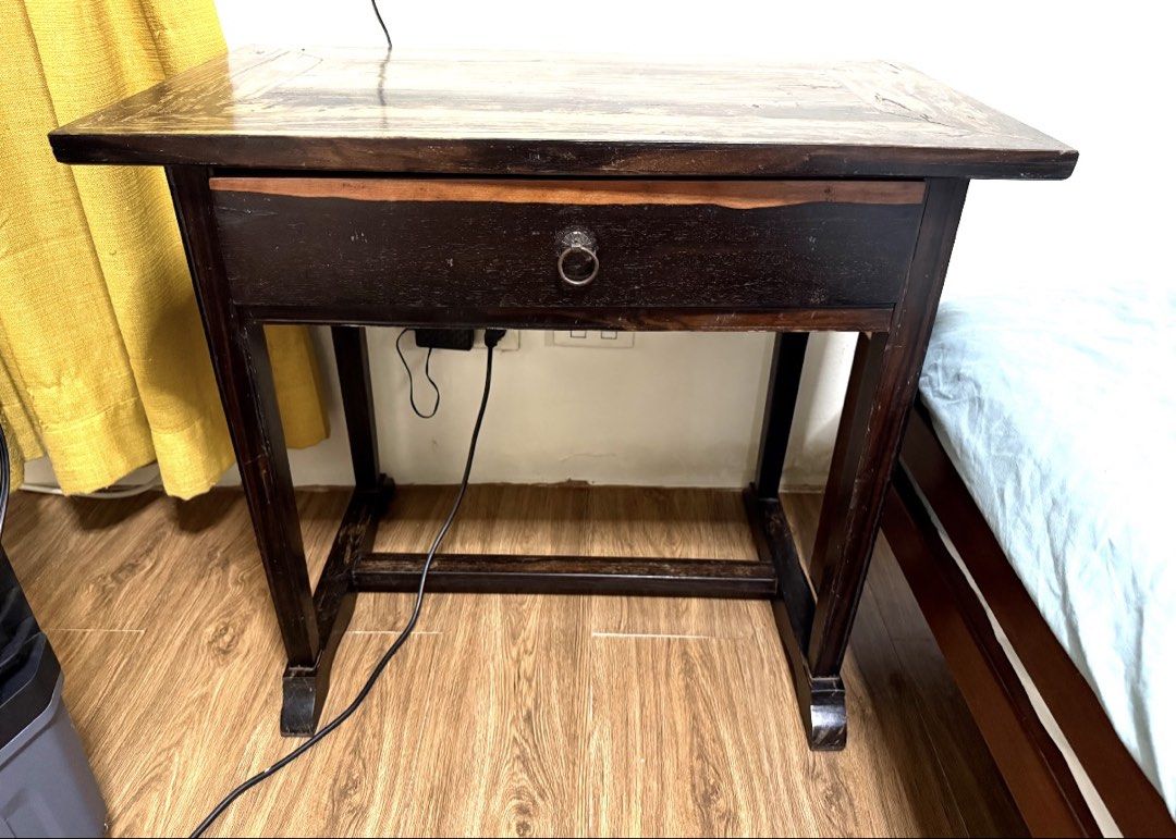 Pure Kamagong Table with Drawer (Category: Tables & Sets) located in Manila. Submitted by golden.leeanne (Listing ID 1438298999, Image 1). Description: - Old piece 30years old from purchase - Wooden side table - Single drawer with metal handle - Dark finish - Light wood grain tabletop - Four-legged design - Perfect for bedroom or living room - Stylish and practical.