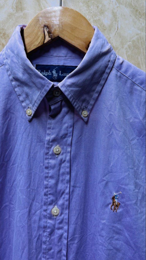 Ralph Lauren Button-Down Shirt (Category: Tshirts & Polo Shirts ) located in Batangas. Submitted by cjayf (Listing ID 1438215007, Image 2). Description: - For Her Large - Ralph Lauren button-down shirt - Classic collar - Long sleeves - Embroidered Ralph Lauren logo - Machine washable - Solid color.