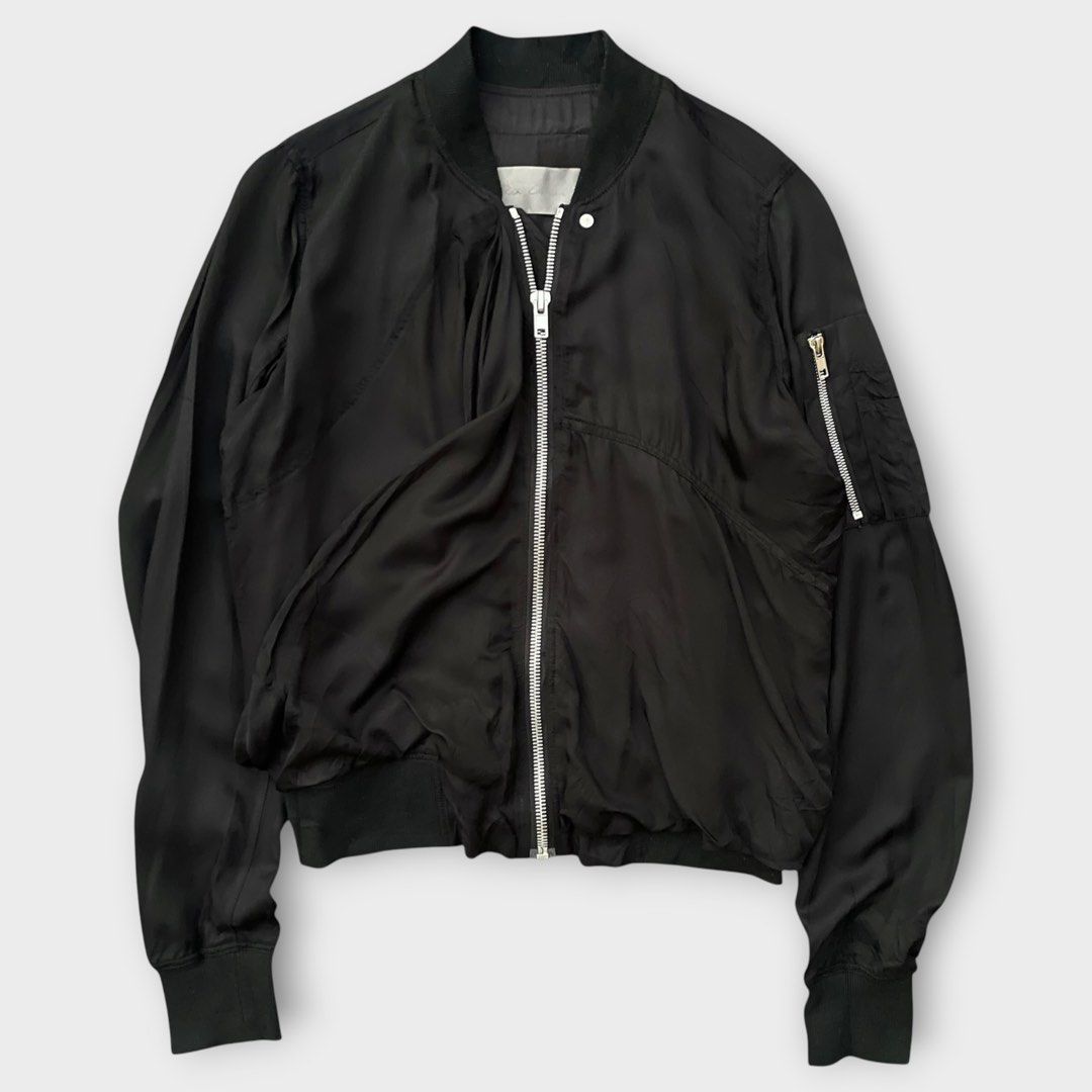 Rick Owens S/S16 - Cyclops - Zipped Ripple Flight Jacket (Category: Coats, Jackets and Outerwear) located in Los Banos. Submitted by declutterking (Listing ID 1438285237, Image 2). Description: Size 36 on tag Long sleeved viscose bomber jacket detailed with stand up collar, zipped arm pocket, asymmetric stitchings to form drapes and rib knitted collar and waistline. Front zip fastening. Fully lined. It is part of Cyclops S/S 16 collection. Slashe