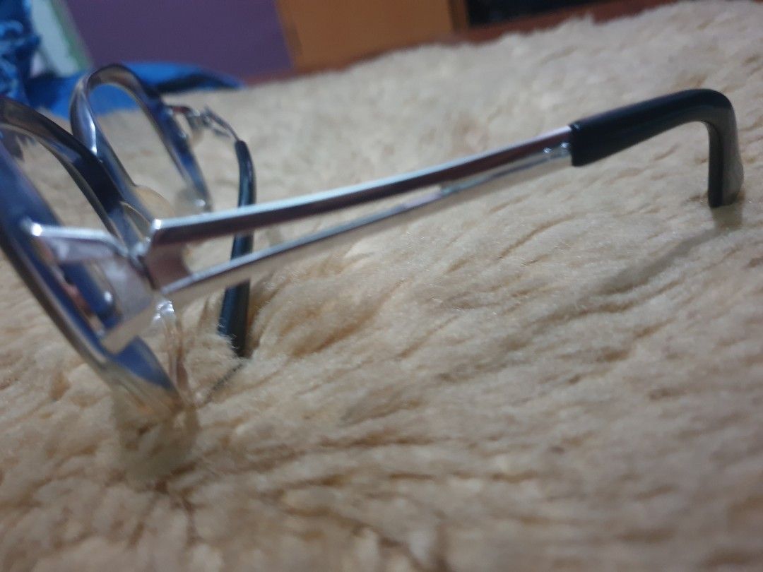 Rodenstock Angelika Eyeglasses (Category: Sunglasses & Eyewear) located in Dasmarinas. Submitted by mysticfalcon.b6bfec (Listing ID 1438123171, Image 3). Description: Rodenstock Sunglass made in germany Stylish eyeglasses with a unique frame design. Features a dark frame with clear lenses. The brand name "Angelika" is visible on the arm. The arm also has the marking "125 Rodenstock". The glasses have a modern look and are suitable for everyday we