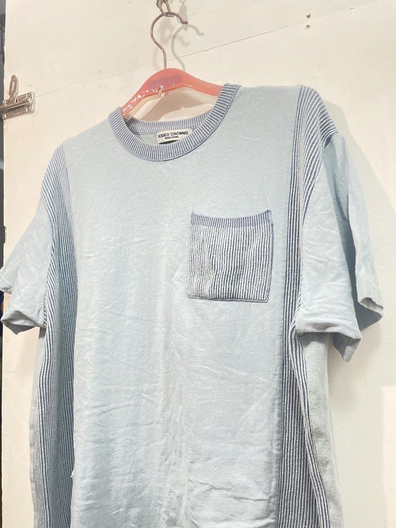 Rodeo Crowns Co. Blue T-shirt (Category: Tshirts & Polo Shirts ) located in Manila. Submitted by ledithgo (Listing ID 1438282002, Image 2). Description: - Rodeo Crowns Co. T-shirt - Light blue color - Striped pocket and accents - Red logo on back with "QUALITY AND COMFORT" and " ANYWAY" - Relaxed fit - Ribbed neckline - Short sleeves.