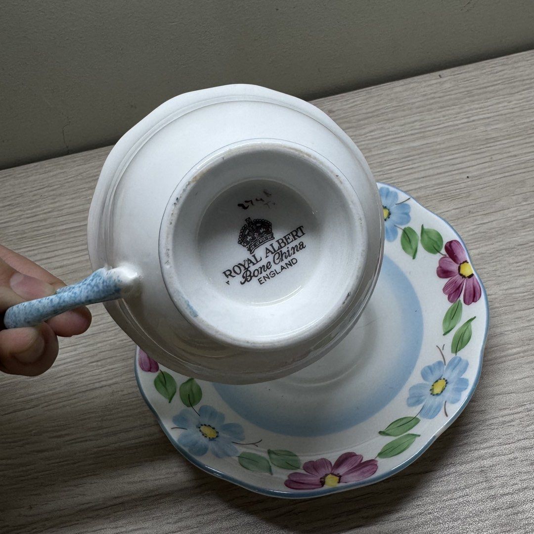 Royal Albert Hand Painted Teacup and Saucer (Category: Coffee & Tea Tableware) located in Manila. Submitted by tibialisanticus (Listing ID 1438212721, Image 2). Description: - Royal Albert Bone China England teacup and saucer set - Beautiful hand painted floral design with blue and purple flowers rfs: decluttering.