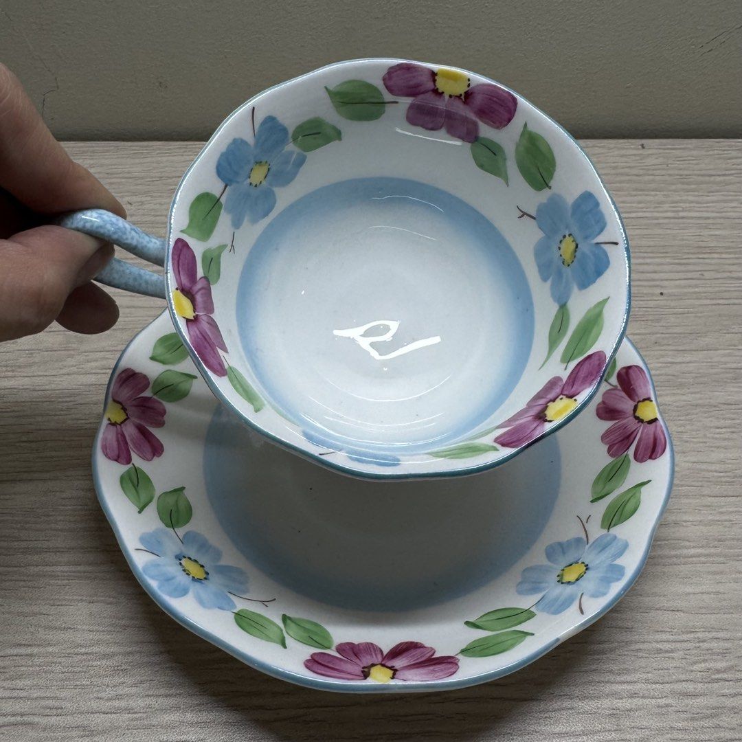 Royal Albert Hand Painted Teacup and Saucer (Category: Coffee & Tea Tableware) located in Manila. Submitted by tibialisanticus (Listing ID 1438212721, Image 1). Description: - Royal Albert Bone China England teacup and saucer set - Beautiful hand painted floral design with blue and purple flowers rfs: decluttering.