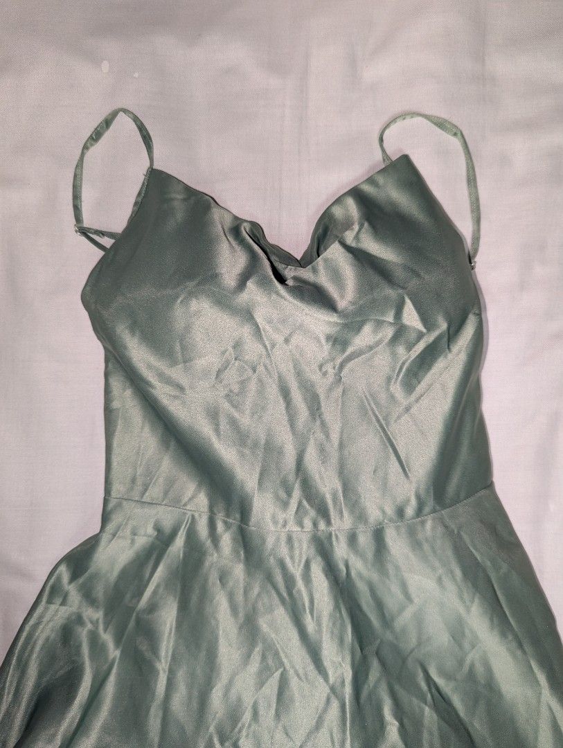 Sage Green Spaghetti Strap Maxi Dress (Category: Dresses) located in Quezon City. Submitted by llue_ (Listing ID 1438192281, Image 3). Description: - Sage green maxi dress - Spaghetti straps - Fitted bodice - Flowing skirt - Back zipper closure - Suitable for formal events and special occasions Excellent condition. Worn once, very clean, and well-maintained. Send a DM if you want more photos or details. Ready to ship! ✨.