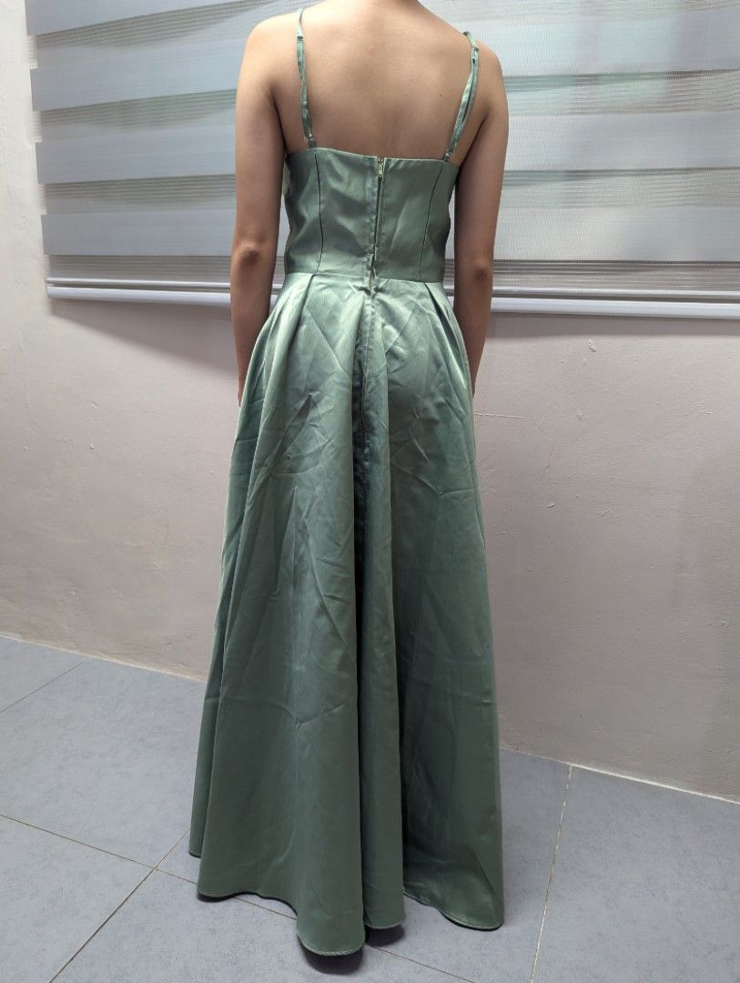 Sage Green Spaghetti Strap Maxi Dress (Category: Dresses) located in Quezon City. Submitted by llue_ (Listing ID 1438192281, Image 2). Description: - Sage green maxi dress - Spaghetti straps - Fitted bodice - Flowing skirt - Back zipper closure - Suitable for formal events and special occasions Excellent condition. Worn once, very clean, and well-maintained. Send a DM if you want more photos or details. Ready to ship! ✨.