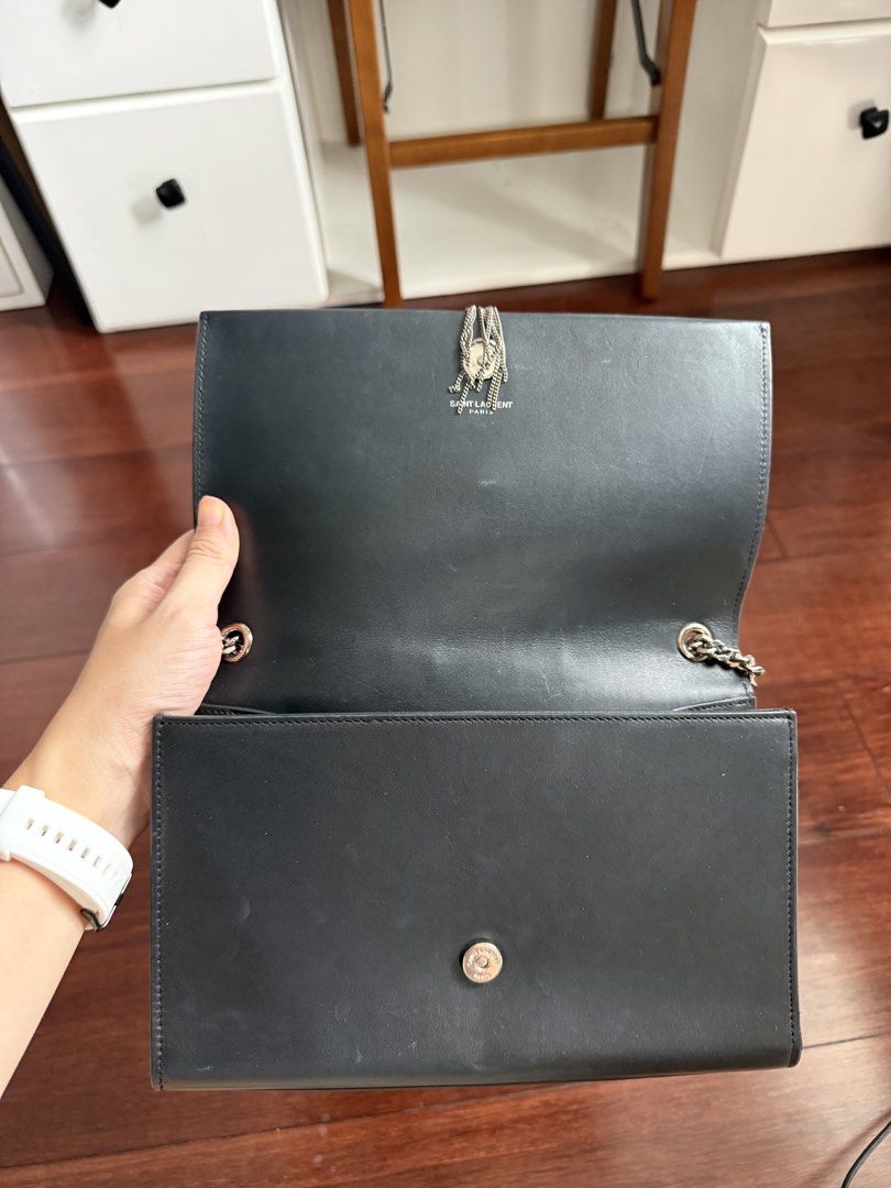 Saint Laurent Kate Tassel Chain Bag (Category: Luxury Bags & Wallets) located in Cebu City. Submitted by siennakats (Listing ID 1438112047, Image 3). Description: Authentic Saint Laurent Kate Tassel Chain Bag in black. Features a silver-tone chain strap and the iconic YSL logo. Includes a dust bag and several cards. The interior is black leather. The bag has a tassel detail. A classic and stylish accessory..