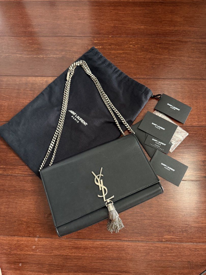 Saint Laurent Kate Tassel Chain Bag (Category: Luxury Bags & Wallets) located in Cebu City. Submitted by siennakats (Listing ID 1438112047, Image 1). Description: Authentic Saint Laurent Kate Tassel Chain Bag in black. Features a silver-tone chain strap and the iconic YSL logo. Includes a dust bag and several cards. The interior is black leather. The bag has a tassel detail. A classic and stylish accessory..
