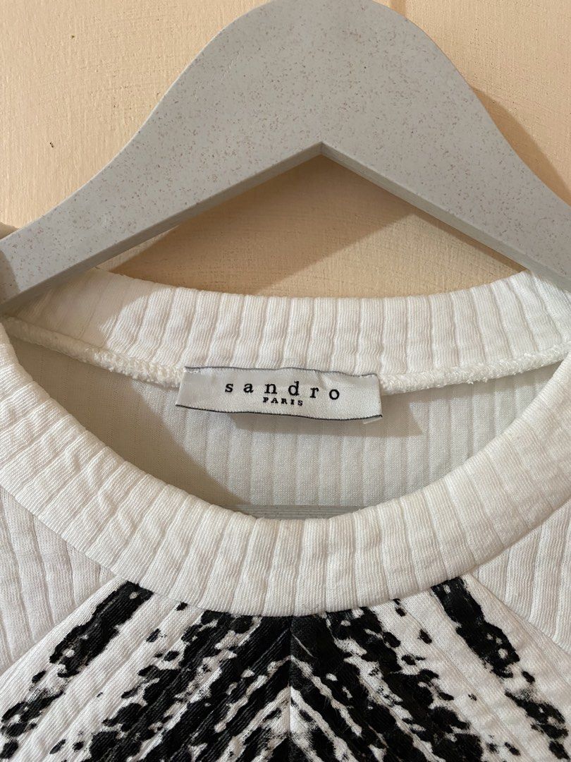 Sandro Paris Chevron Raglan-Style Knit White Sweater (Category: Longsleeves) located in Naga. Submitted by trashfinds (Listing ID 1438155118, Image 3). Description: Size: 1 on tag Length: 23.5” Width: 17.5” Color rate : 9/10 Issue : Minor stain on bottom hem see Last pic.