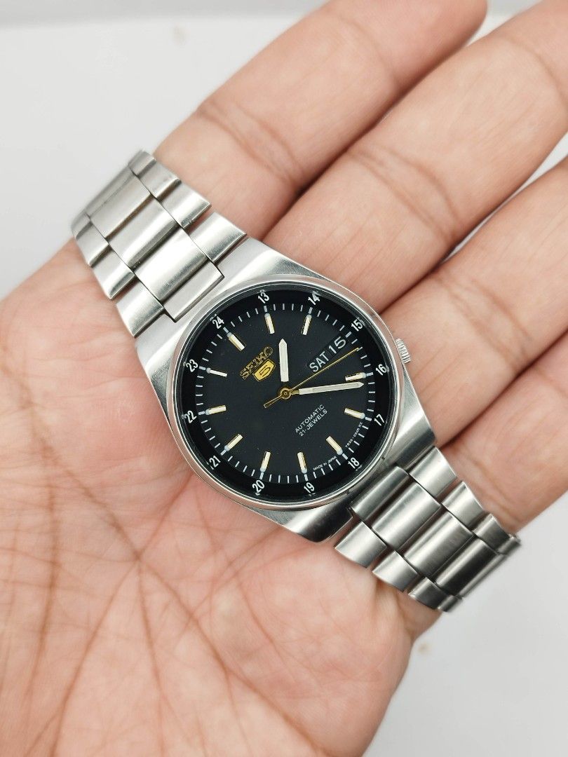 Seiko 5 military watch (Category: Men's Watches) located in Quezon City. Submitted by WatchProject (Listing ID 1438278483, Image 1). Description: original Seiko 5 watch refurbished back case aftermarket dial and hands 37mm case dm 7009 movement in good running condition extended links upto 8 inches wrist watch unit only.