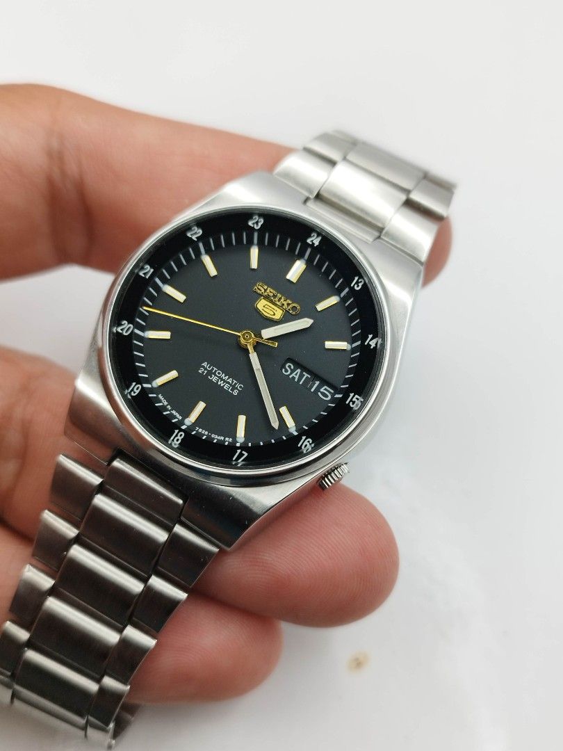 Seiko 5 military watch (Category: Men's Watches) located in Quezon City. Submitted by WatchProject (Listing ID 1438278483, Image 3). Description: original Seiko 5 watch refurbished back case aftermarket dial and hands 37mm case dm 7009 movement in good running condition extended links upto 8 inches wrist watch unit only.