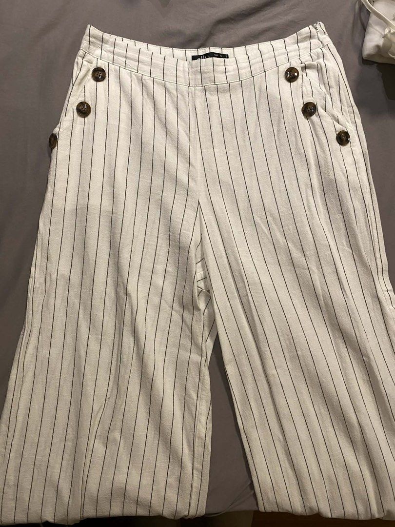 Striped Pants with Button details (Category: Other Bottoms) located in Caloocan City. Submitted by b4wang (Listing ID 1438163432, Image 2). Description: - ankle length (i’m 5’2) - cute button detail - side zipper closure - dm for when worn! waist band front length 14” waist band to bottom length 33”.