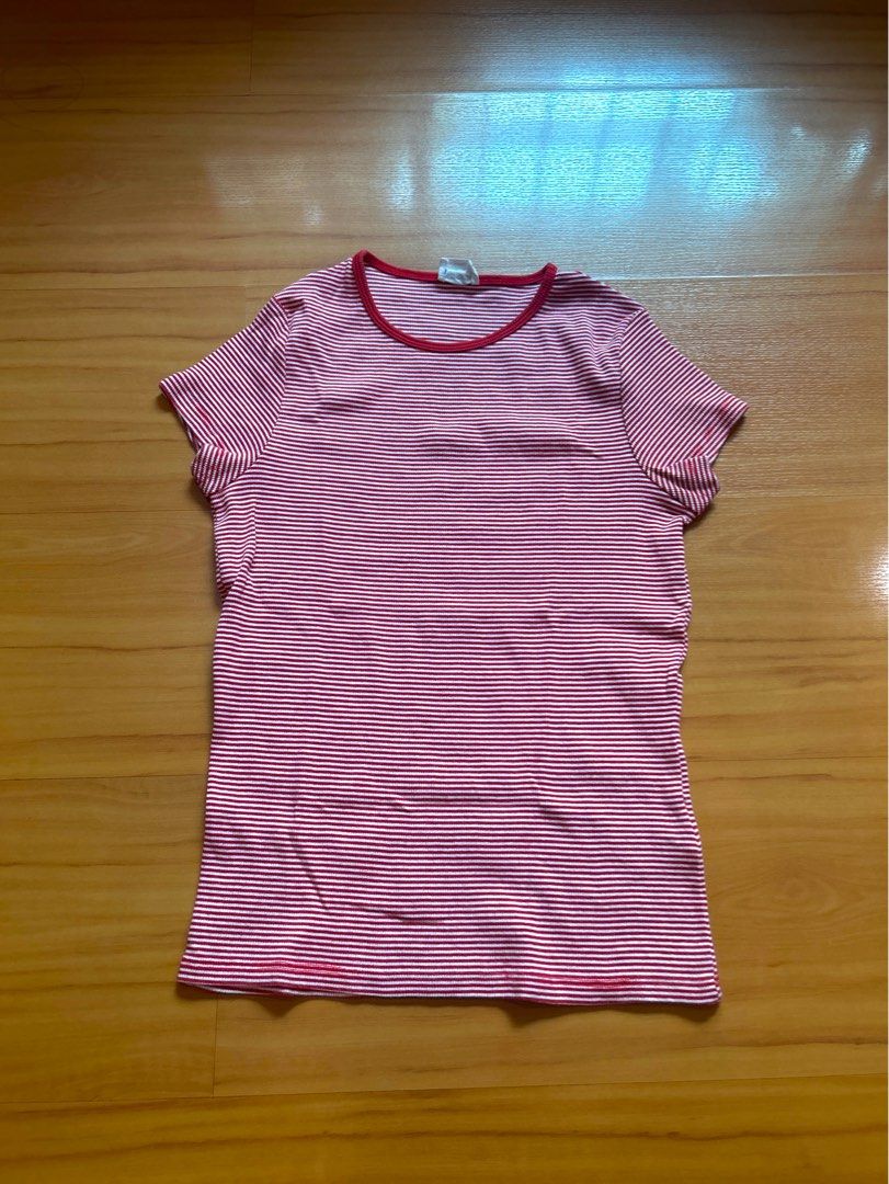 Striped Red and White T-shirt (Category: Shirts) located in San Juan City. Submitted by porygon (Listing ID 1438164707, Image 1). Description: - Classic red and white striped design - Comfortable, soft material - Features a round neckline - Short sleeves - Versatile for casual outfits - Worn once or twice, good as new - Price negotiable for sure buyer! Ps. The red lines at the bottom are its hem stitches. It is not noticeable in real life :) #y2k