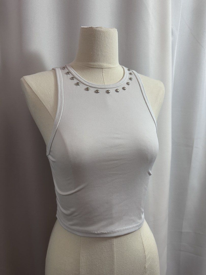 ‼️AVAIL - Studded Tank White Ribbed Crop Top with Studs (Category: Others Tops) located in Baguio. Submitted by st0nefox (Listing ID 1438287827, Image 1). Description: - White crop top - Ribbed texture - Round neckline with silver studs - Sleeveless - Comfortable, stretchy fabric - Perfect for warmer weather - Pairs well with high-waisted bottoms.
