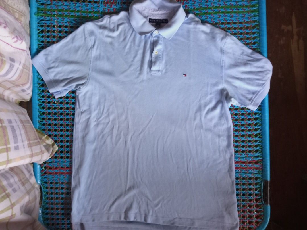 Tommy Hilfiger Classic Pique Polo (Category: Tshirts & Polo Shirts ) located in Manila. Submitted by xthirft_finderx (Listing ID 1438127597, Image 2). Description: Tommy Hilfiger Classic Pique Polo Essential sky blue solid colorway Signature mini flag chest embroidery Premium cotton pique breathable knit Size: Large (L/G) Production Date: September 2007 (Vintage) Condition: Thrifted / Excellent pre-loved state Care Instructions: Wash dark colors 