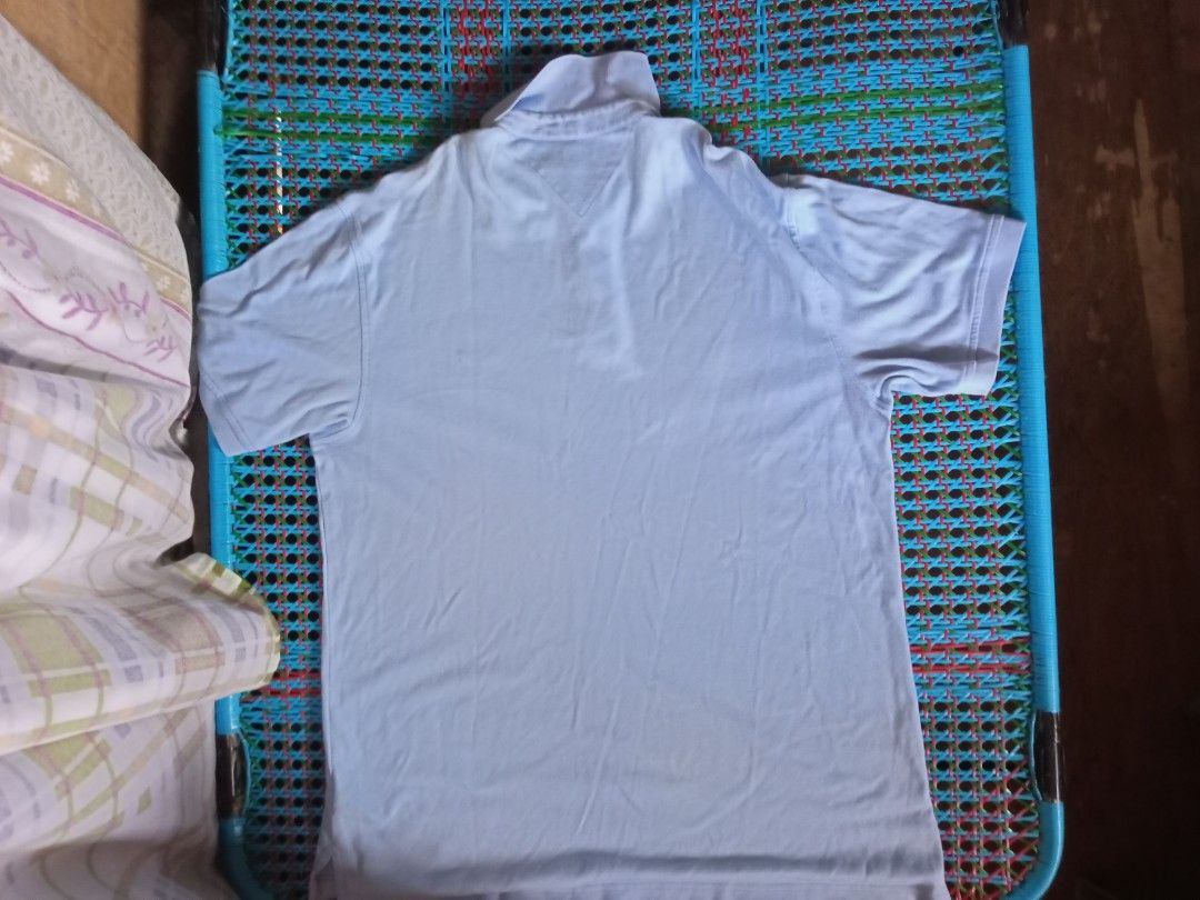 Tommy Hilfiger Classic Pique Polo (Category: Tshirts & Polo Shirts ) located in Manila. Submitted by xthirft_finderx (Listing ID 1438127597, Image 3). Description: Tommy Hilfiger Classic Pique Polo Essential sky blue solid colorway Signature mini flag chest embroidery Premium cotton pique breathable knit Size: Large (L/G) Production Date: September 2007 (Vintage) Condition: Thrifted / Excellent pre-loved state Care Instructions: Wash dark colors 