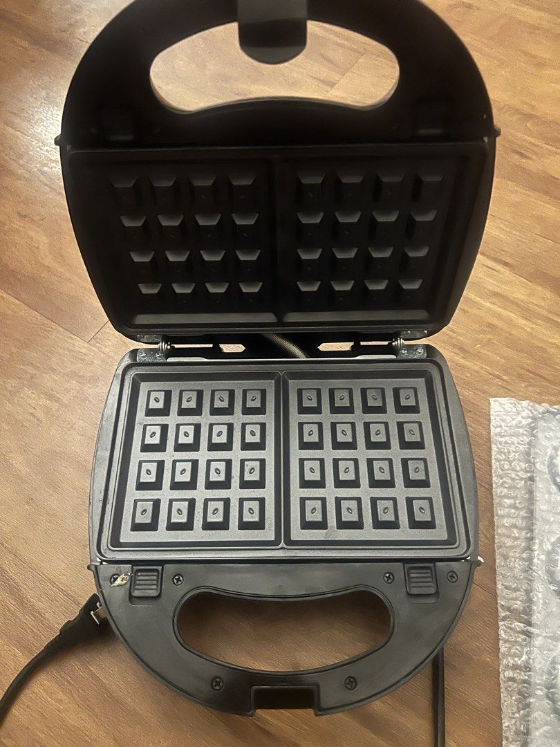 Tough Mama Multi-Function Waffle Maker (Category: Other Kitchen Appliances) located in Quezon City. Submitted by shopclosetttt (Listing ID 1438256266, Image 2). Description: Used twice. Good as new. - Multi-function waffle maker with 4 interchangeable plates - Non-stick surface for easy cooking and cleaning. - Features indicator lights for operation SRP 1,700+ Selling for 1,299.