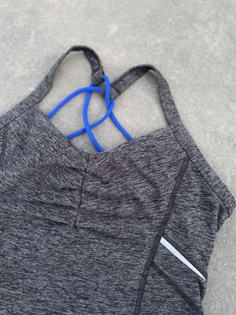 Under Armour Tank Top with Blue Straps (Category: Sleeveless) located in Taguig. Submitted by kayecheng (Listing ID 1438293959, Image 2). Description: Under Armour tank top with blue straps, gray marled fabric, and white accents. Features a unique back strap design and Under Armour logo. Comfortable and athletic..