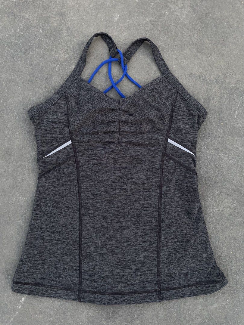 Under Armour Tank Top with Blue Straps (Category: Sleeveless) located in Taguig. Submitted by kayecheng (Listing ID 1438293959, Image 1). Description: Under Armour tank top with blue straps, gray marled fabric, and white accents. Features a unique back strap design and Under Armour logo. Comfortable and athletic..
