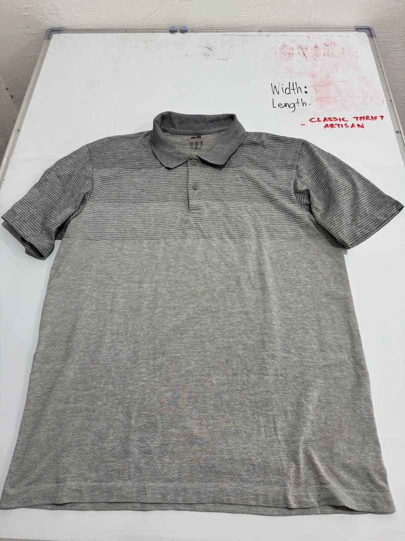 Uniqlo Polo Shirt (Category: Tshirts & Polo Shirts ) located in Cebu City. Submitted by oryenz (Listing ID 1438264175, Image 2). Description: - Uniqlo polo shirt - Gray color - Striped pattern on upper chest - Solid gray on lower part - Collared neckline - Short sleeves - Two-button placket - Uniqlo logo detail.