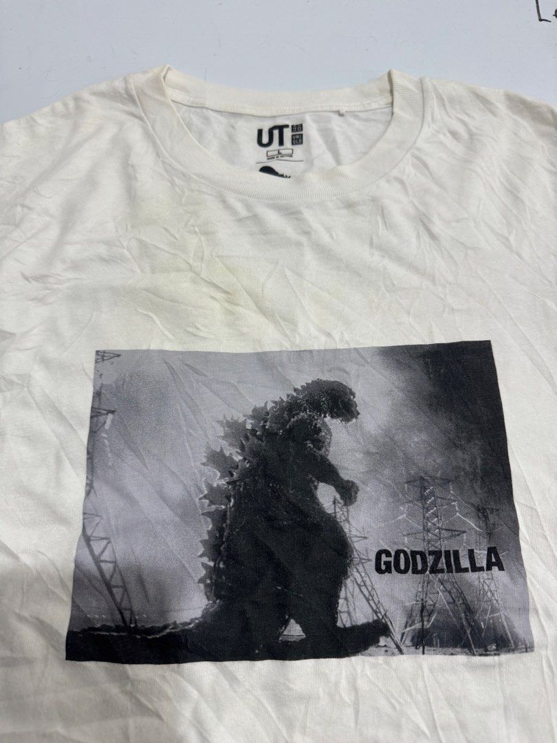 Uniqlo UT Godzilla Graphic Tee (Category: Tshirts & Polo Shirts ) located in Cebu City. Submitted by oryenz (Listing ID 1438263957, Image 2). Description: - Uniqlo UT t-shirt - Features a Godzilla graphic - White, short-sleeved - Graphic on the sleeve - Uniqlo logo on collar - Size not specified.