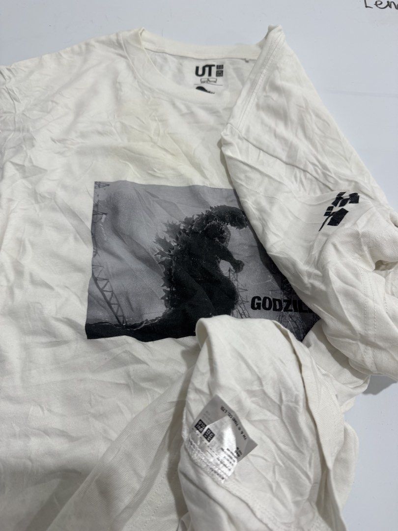 Uniqlo UT Godzilla Graphic Tee (Category: Tshirts & Polo Shirts ) located in Cebu City. Submitted by oryenz (Listing ID 1438263957, Image 3). Description: - Uniqlo UT t-shirt - Features a Godzilla graphic - White, short-sleeved - Graphic on the sleeve - Uniqlo logo on collar - Size not specified.