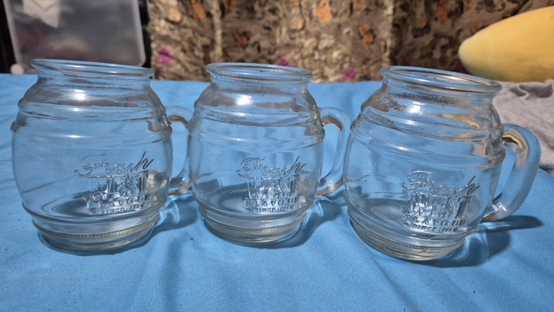 Vintage Glass Mugs with Handle (Category: Coffee & Tea Tableware) located in Makati City. Submitted by caesteban (Listing ID 1438267076, Image 1). Description: - Set of three vintage glass mugs - Made of clear glass - Approximately 4 inches in diameter 100php each 250php take all.