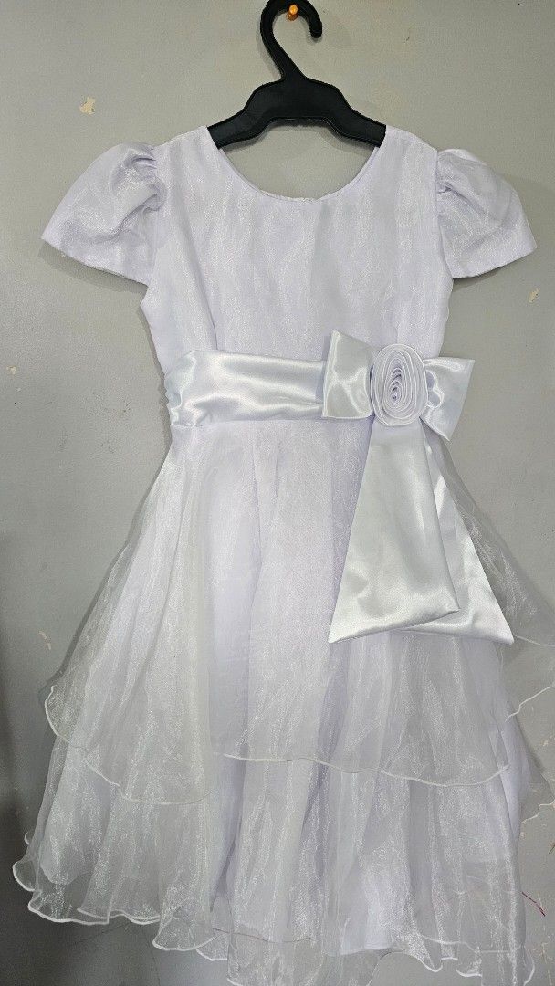 White Dress with Bow (Category: Dresses) located in Taguig. Submitted by periscopic (Listing ID 1438183825, Image 1). Description: - White dress with satin bow - Delicate tulle detailing - Short sleeves - Layered skirt - Includes satin belt - Perfect for special occasions -fits 5-7yrs old (best for graduation, weddings) .