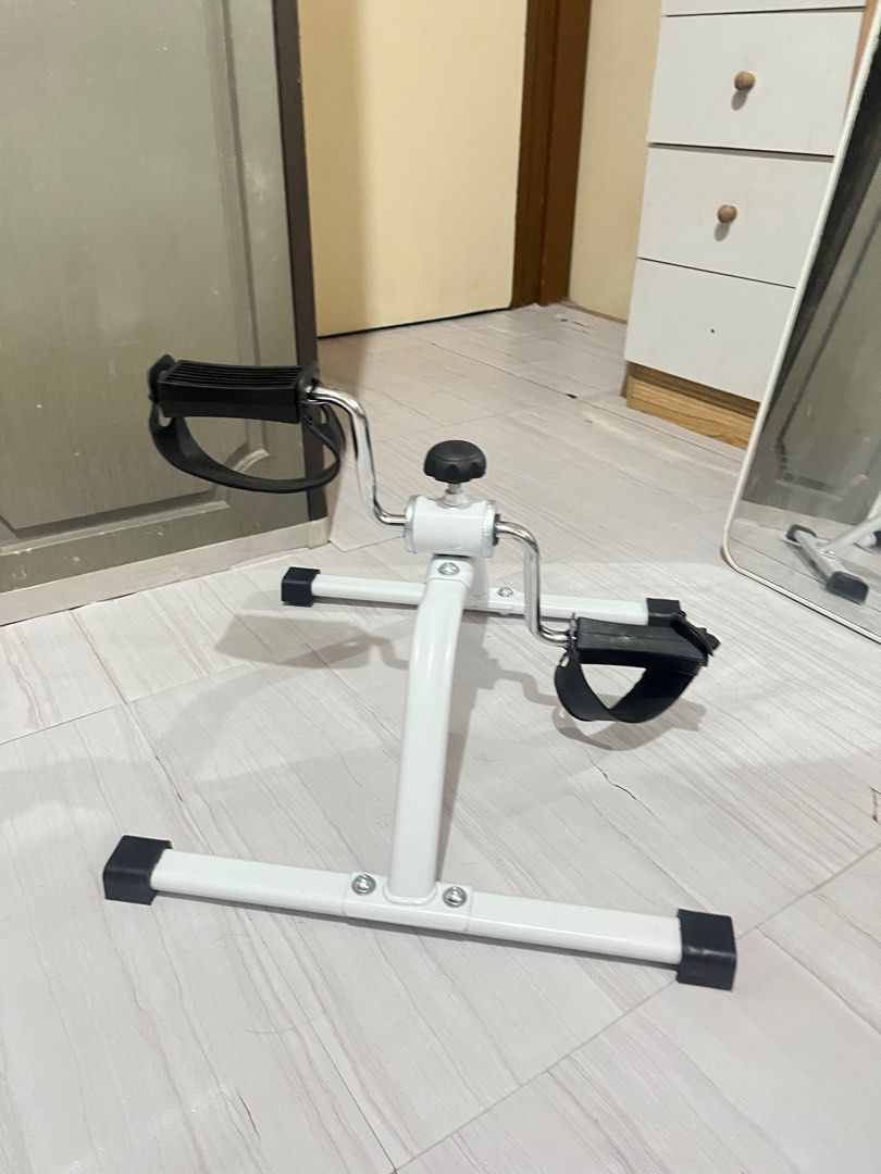 White Exercise Pedal for elderly or adult (Category: Cardio & Fitness Machines) located in Paranaque City. Submitted by prelovedbypachi (Listing ID 1438186042, Image 3). Description: - White exercise pedal - Adjustable resistance - For arm and leg exercises - Sturdy base with rubber feet - Easy to store and use - Suitable for home workouts.