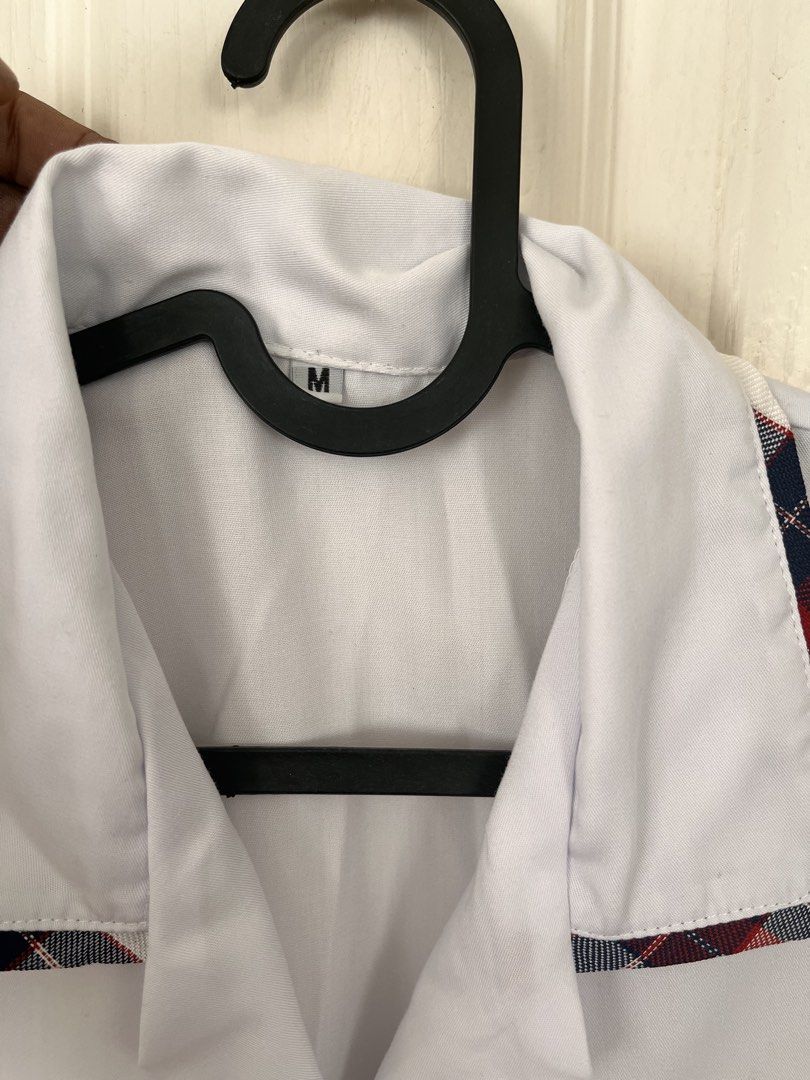 White Uniform Shirt - Size M (Category: Shirts) located in Bacoor. Submitted by clothestodeclutter (Listing ID 1438144510, Image 1). Description: - White uniform shirt - Size: M - Collared neckline - Plaid trim on collar and sleeves (red, white, and blue).