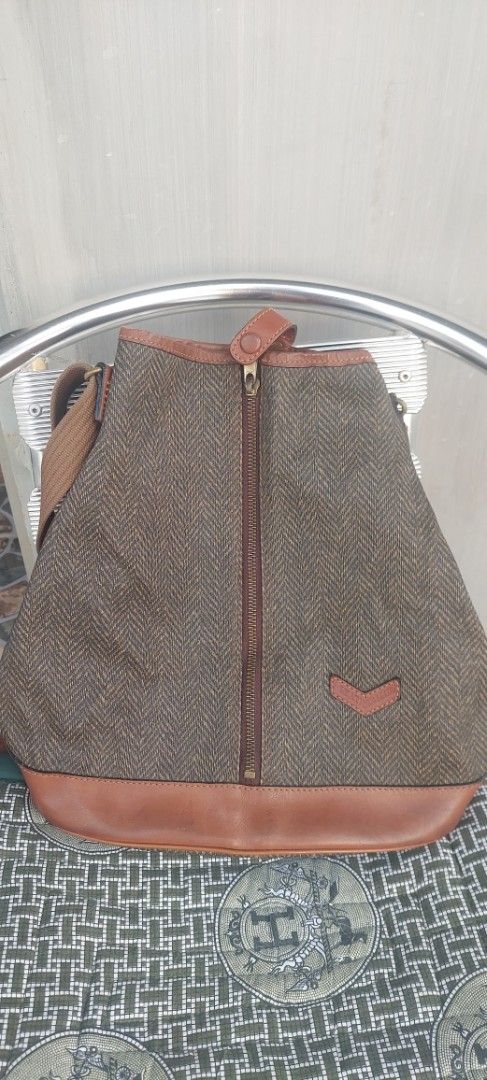 Why Bucket Bag Style (Category: Tote Bags) located in Batangas. Submitted by roams (Listing ID 1438174105, Image 1). Description: - Brown herringbone fabric sling bag - Leather - Adjustable strap - Gold-toned hardware - Unique leather detail on front - Interior pocket wala na lang nakasabit na why just pm.