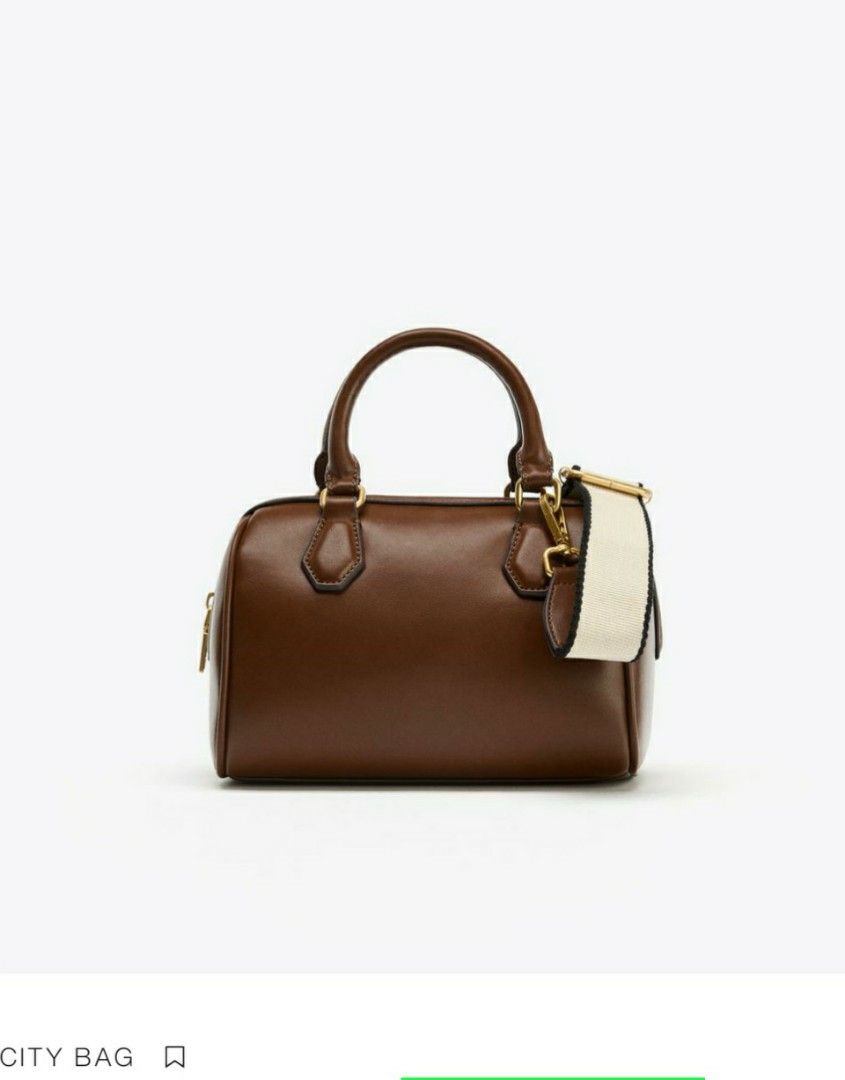 ZARA BAG (Category: Cross-body Bags) located in Tagum. Submitted by minimelstuff (Listing ID 1438245799, Image 1). Description: - Brown City Bag handbag - Top handle and detachable shoulder strap - Zipper closure - Gold-colored hardware - Patterned lining - Canvas strap with black detailing - Ideal for everyday use - with dust bag.