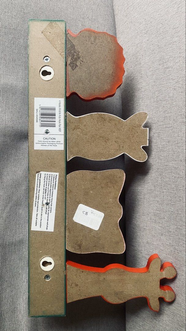 4 Hooks Wildlife Kids Hook Rail MDF (Category: Hooks & Hangers) located in Quezon City. Submitted by smithram (Listing ID 1438360067, Image 3). Description: It has a green MDF wood base with four white cylindrical peg hooks. It features four colorful, cartoon-style jungle animals peeking over the top bar: a giraffe, elephant, zebra, and lion..